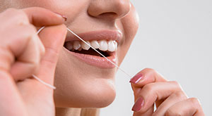 Как использовать зубную нить?